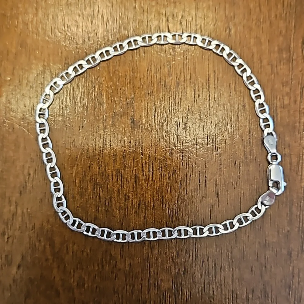 Three silver-toned bracelets - at least one is sterling silver - Picture 2 of 5